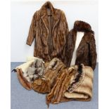Two rabbit fur silk-lined ladies’ coats; various fur stoles, etc., & a simulated fur rug.