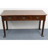 A mahogany side table, fitted three frieze drawers, on round tapered legs & pad feet, 51” wide