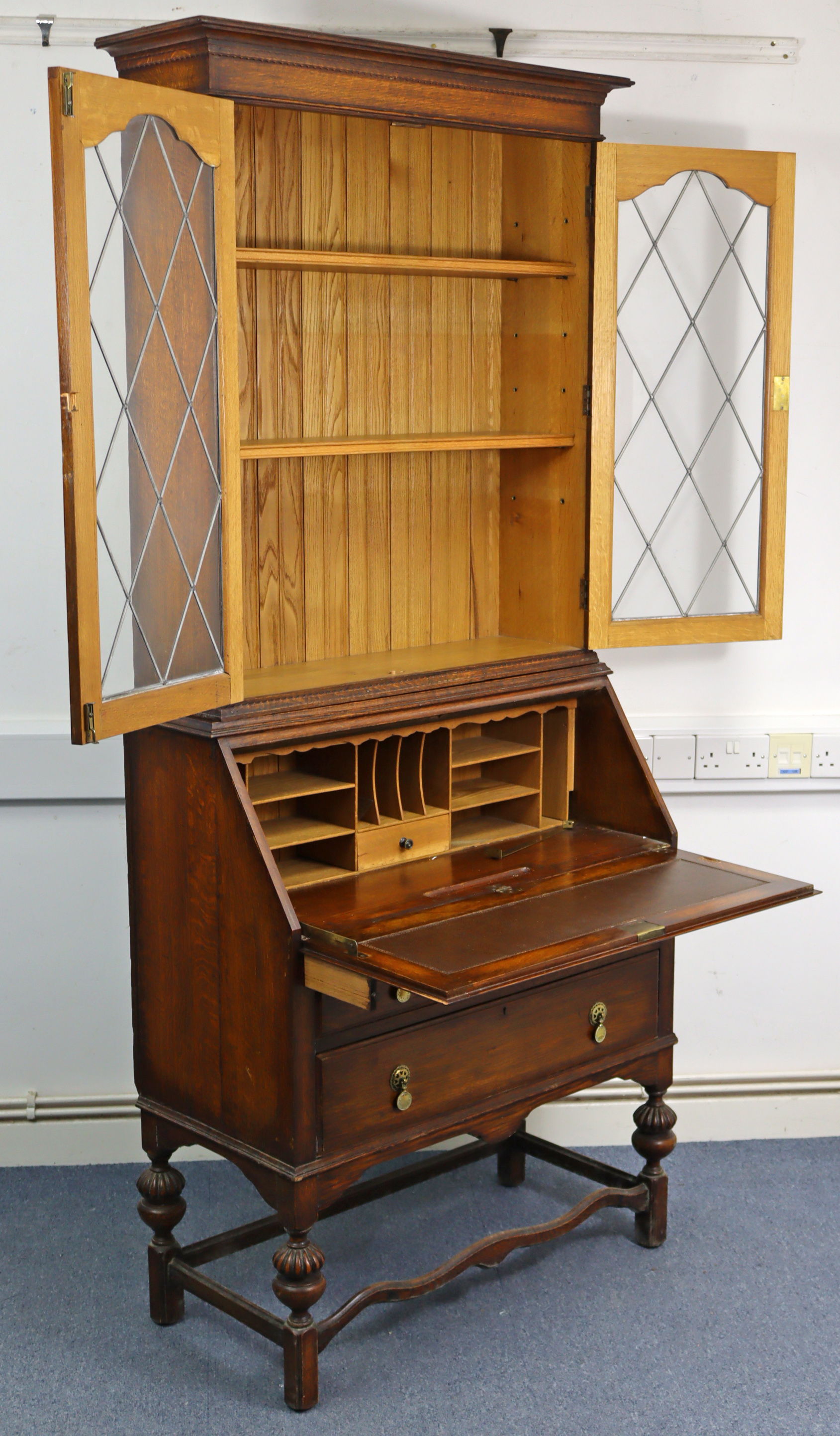 A 1930’s oak bureau-bookcase, the upper part with two adjustable shelves enclosed by pair of - Image 3 of 4