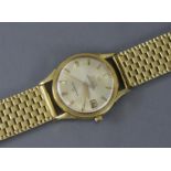 AN 18ct. GOLD OMEGA CONSTELLATION GENT’S SELF-WINDING BRACELET WATCH, the 28mm circular pale champa
