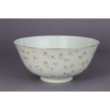 A Chinese porcelain bowl of off-white ground, the exterior with all-over decoration of blossoming