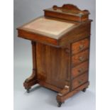 A late Victorian inlaid-rosewood davenport, the raised back enclosing stationery compartments,