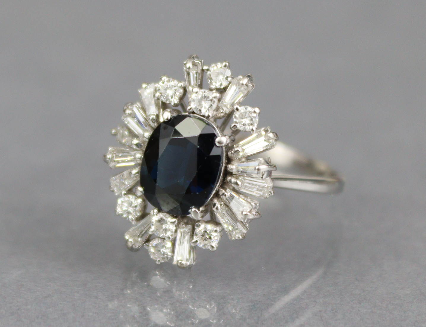 A SAPPHIRE & DIAMOND RING, the oval-cut sapphire approx. 2 carats set within a radiating border of - Image 2 of 4