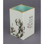 A Chinese porcelain small square brush pot with en-grissaille decoration of rock-work & foliage,