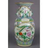 A Chinese porcelain large ovoid vase, with flared rim, decorated all-over with brightly coloured