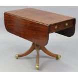 A regency mahogany drop-leaf supper table, with rounded corners & reeded edge, fitted frieze drawer,