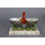 A 19th century Paris porcelain inkstand in the form of the two halves of an open clam shell, each