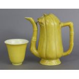 A 19th century Chinese porcelain monochrome yellow “Cadogan” teapot in the form of a gourd, with