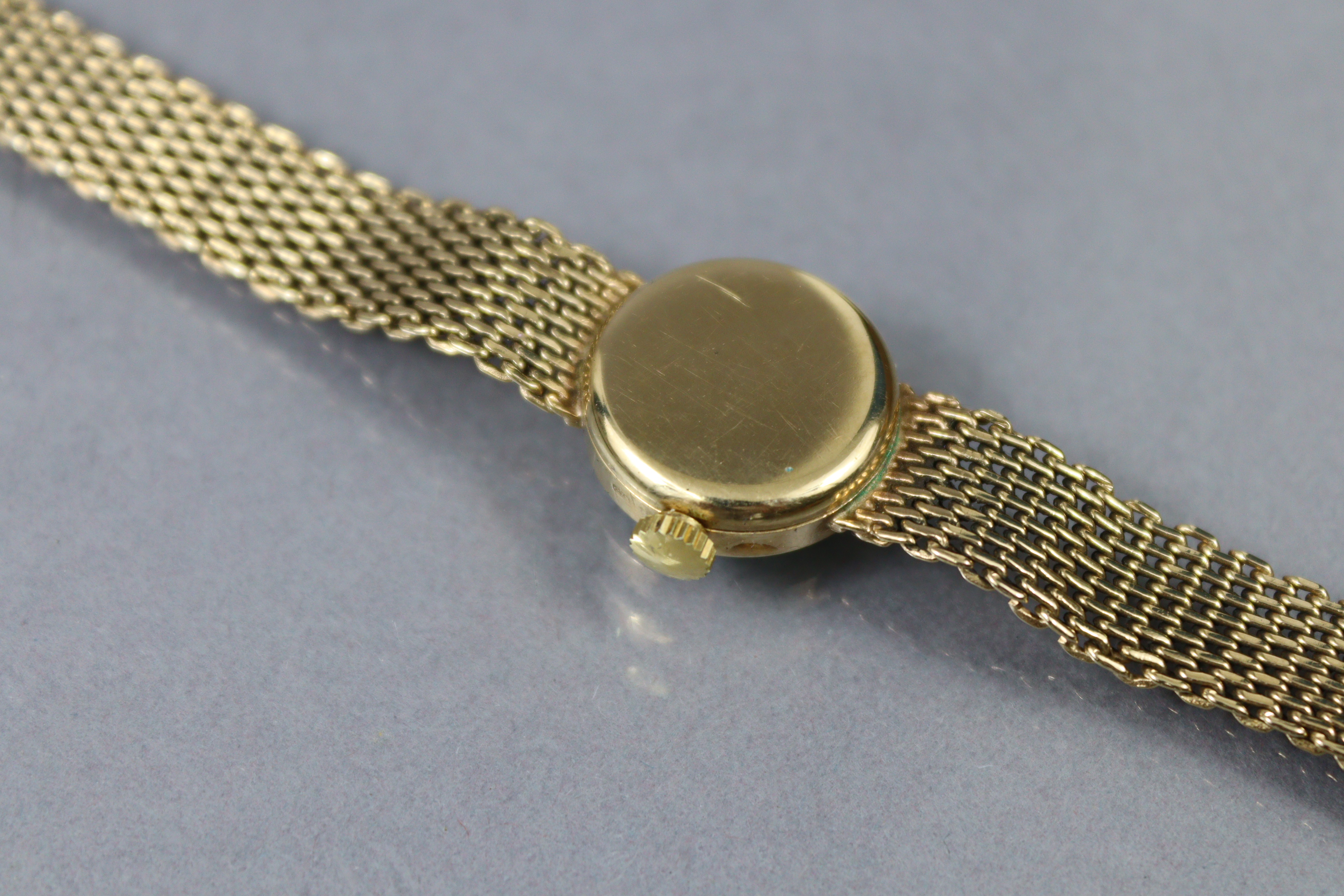 A Tissot 9ct. gold ladies’ bracelet watch with baton numerals to the small circular silvered dial, - Image 3 of 4