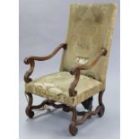 A William & Mary-style carved walnut frame armchair, with tall padded back & sprung seat upholstered