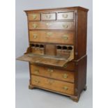 A George III oak secretaire chest-on-chest, fitted three short & six long graduated drawers with