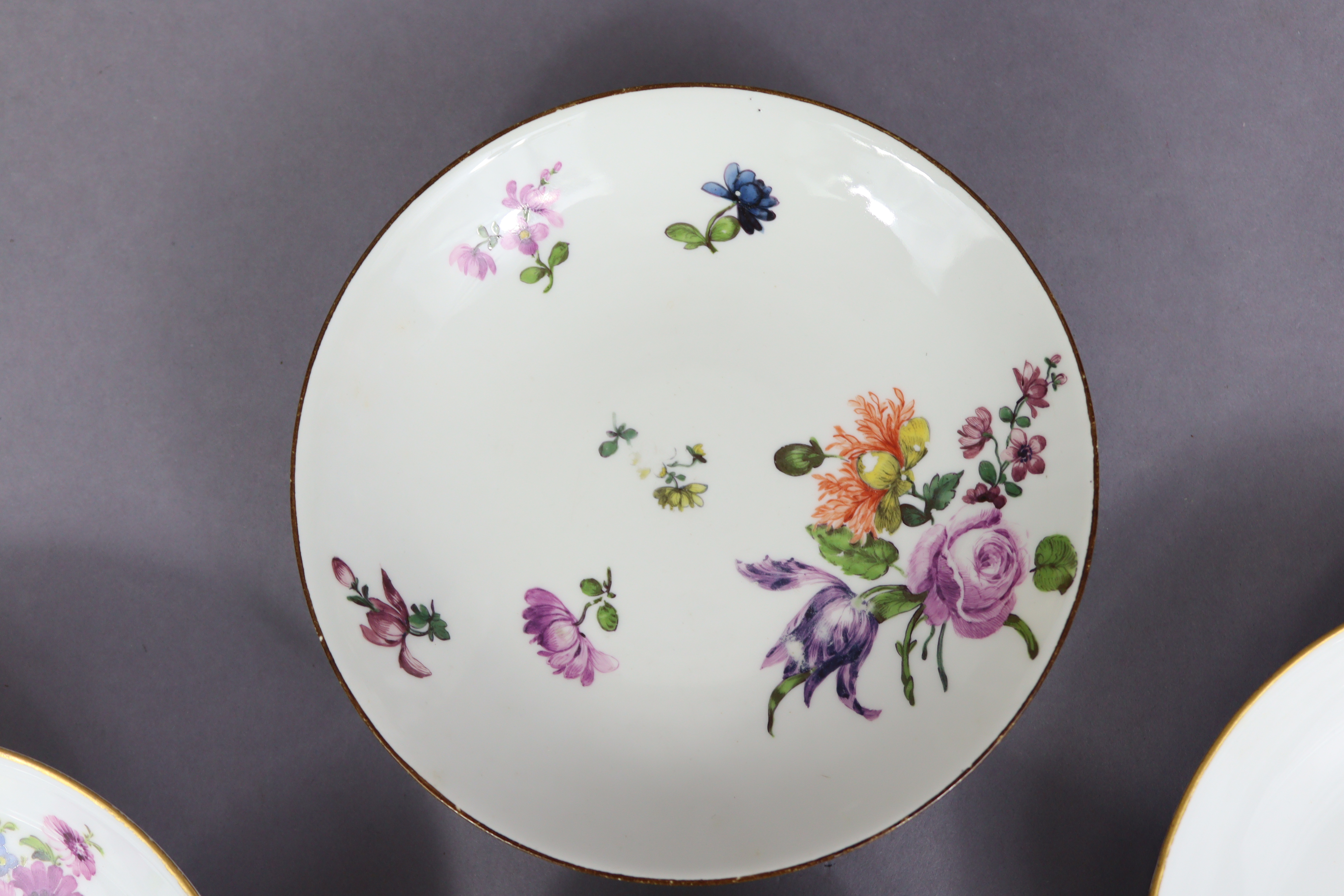 An 18th century Meissen porcelain saucer painted with flower-sprays & with brown rim, 5¼” diam.; a - Image 4 of 9