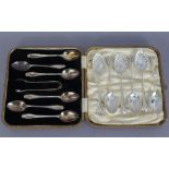 A set of six silver coffee spoons & matching tongs, Sheffield 1929, in fitted case; & a set of