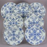 A set of seven 18th century Chinese blue & white porcelain plates with stylised floral decoration, &
