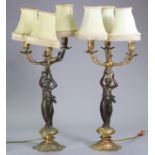 A pair of 19th century bronze & gilt brass three-branch table lamps, each with scrolling arms