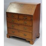 A mid-18th century mahogany small bureau, with fitted interior enclosed by sloping fall-front above