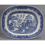 A very large 19th century blue transfer “Willow” pattern meat plate, 25” x 19½”; & two similar