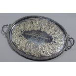 A late Victorian electro-plated oval two-handled tray with beaded rim, the centre with wide engraved