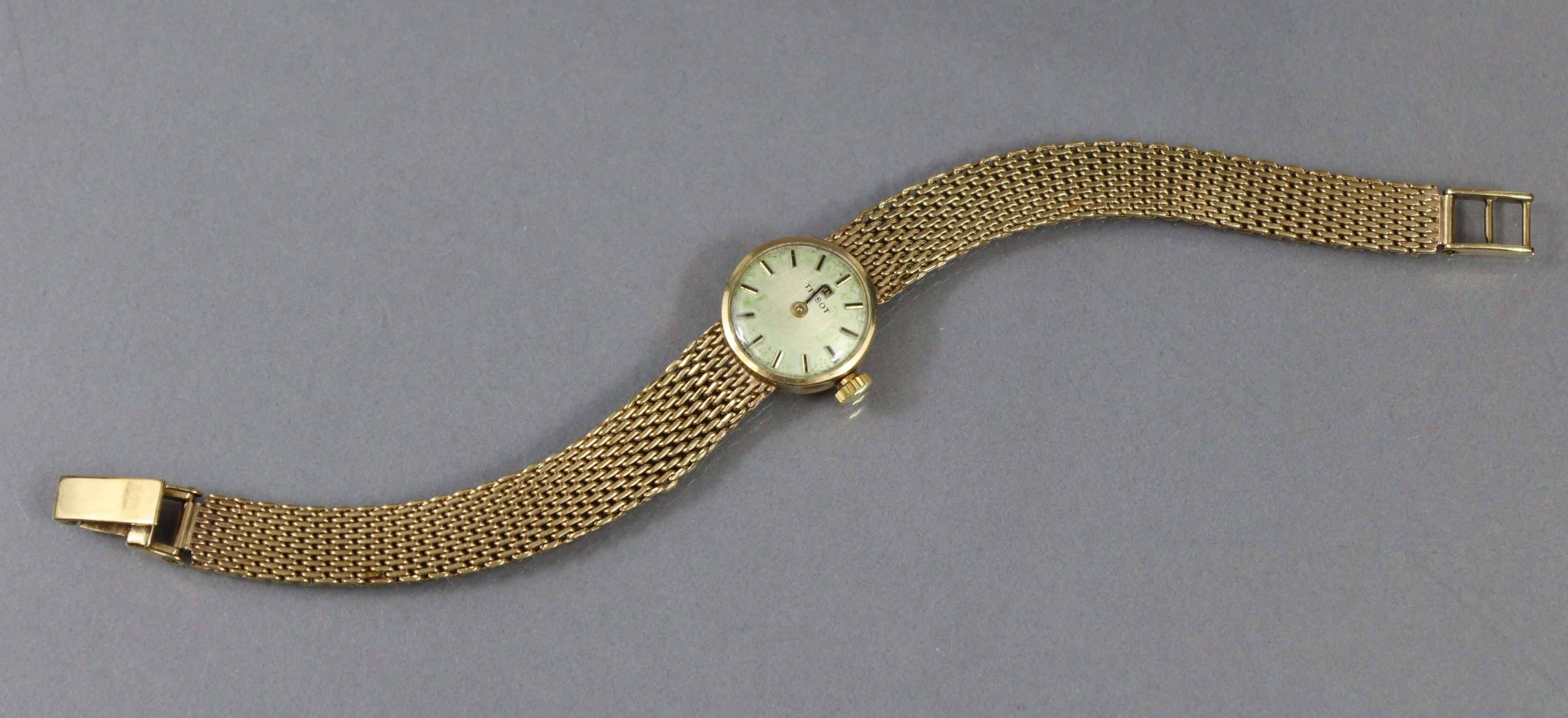 A Tissot 9ct. gold ladies’ bracelet watch with baton numerals to the small circular silvered dial, - Image 2 of 4