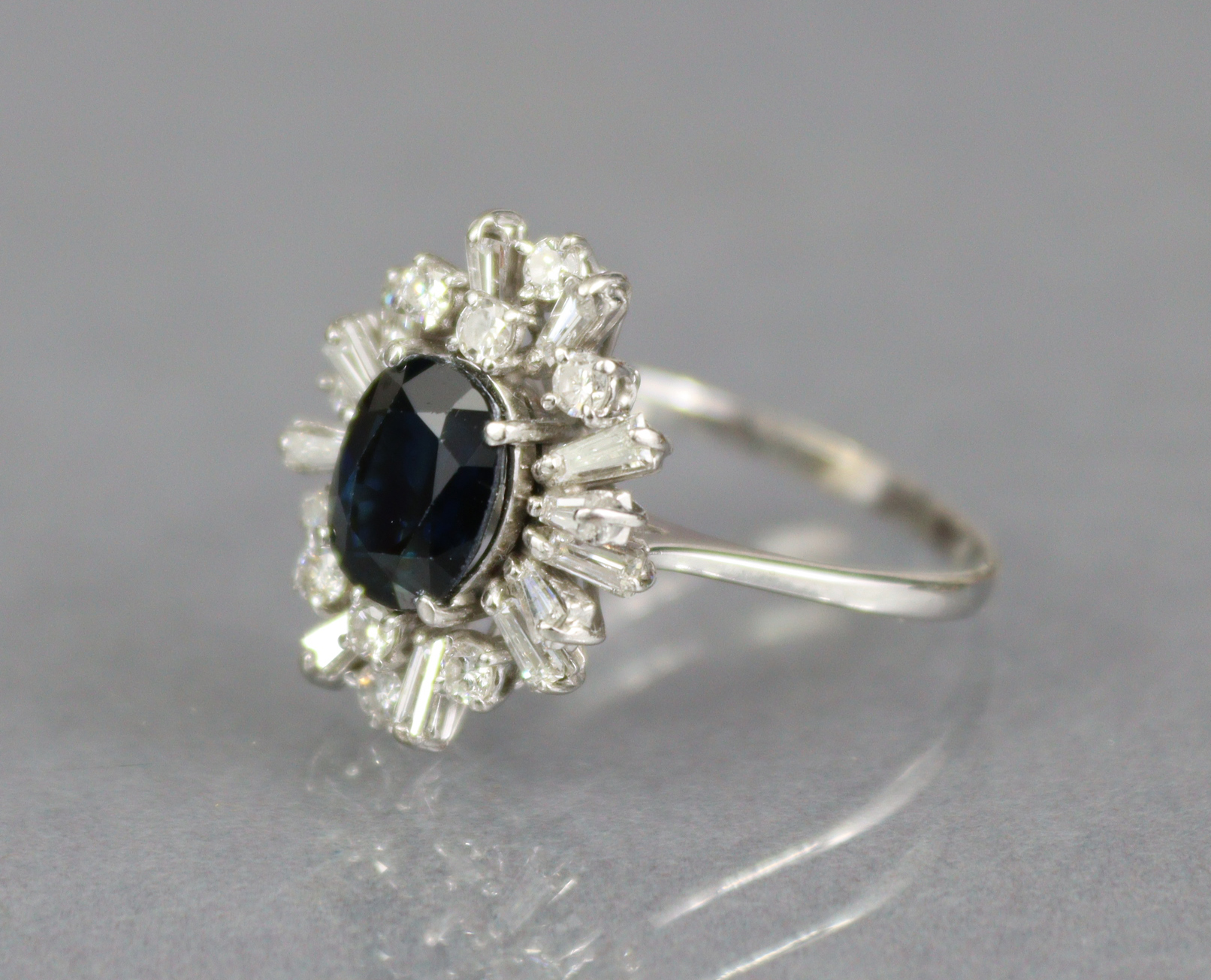 A SAPPHIRE & DIAMOND RING, the oval-cut sapphire approx. 2 carats set within a radiating border of - Image 3 of 4