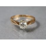 A diamond solitaire, the round-cut stone approx. 0.5 carat, set to an un-marked yellow metal