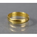 A 22ct. gold wedding band, London 1961; Size: K/L, weight: 2.8gm.