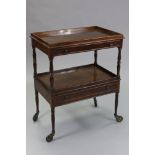 A Victorian mahogany two-tier rectangular trolley, each tier having tray-top with mock-drawer to the