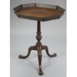 A Victorian mahogany tripod table in the Chippendale style, the rectangular top with canted corners