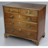 An 18th century mahogany chest with moulded edge to the plain rectangular top, fitted two short &