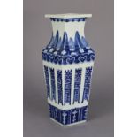 A Chinese blue & white porcelain square baluster vase with flared neck, decorated with archaic