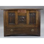 A SCOTTISH ARTS & CRAFTS OAK COFFER, with carved foliate panels by John W. Bennett, the central