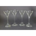 A set of four unusual cut glass tall wine glasses, each with slender stem & on hexagonal foot; 7½”
