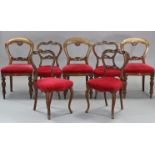 A similar matched set of seven mid-Victorian carved mahogany & rosewood balloon-back dining chairs.