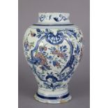 An 18th century Dutch polychrome delft baluster vase with short neck & all-over floral decoration in