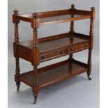 An early Victorian mahogany buffet of three tiers, fitted two canteen drawers, with fluted finials,