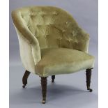 A Victorian mahogany frame tub-shaped armchair with buttoned back & down-swept arms, upholstered