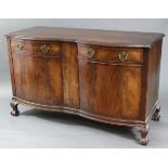 An early 20th century mahogany veneered double bow-front sideboard enclosed pair of panel doors