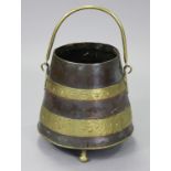 A 19th century copper & brass-bound tapered cylindrical coal bucket with embossed swag decoration, &