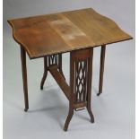 A late Victorian mahogany Sutherland table, with rosewood crossbanding to the serpentine shaped top,