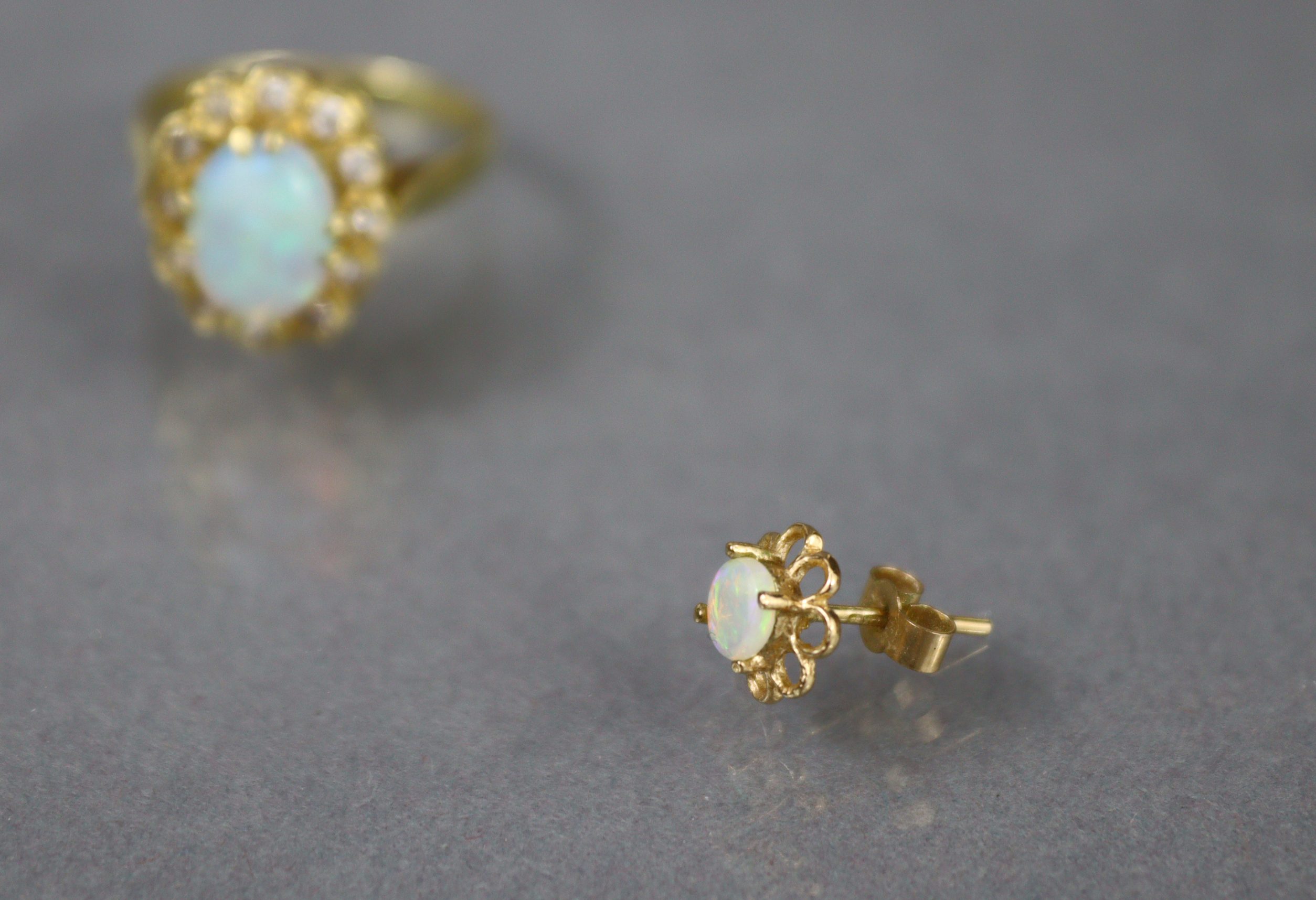 An 18ct. gold ring set oval opal within a border of small diamonds, Birmingham hallmarks for 1875; - Image 6 of 6