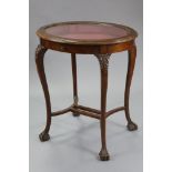A mid-late Victorian mahogany oval bijouterie table, the glazed top inset pink velour, on slender