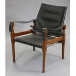 A mid-late 20th century rosewood frame low armchair in the style of Le Corbusier, with black