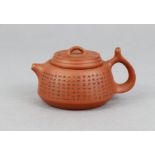 A Chinese Yixing inscribed squat-round teapot, with removable cover, loop handle, & short spout, the