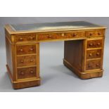 A Victorian burr-walnut pedestal desk, with moulded edge to the rectangular top, inset gilt-tooled