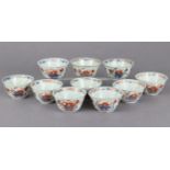 A set of ten 18th century Chinese Imari teabowls with floral decoration in underglaze blue, iron-