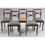 A set of five Regency mahogany dining chairs with rope-twist & reeded top-rails, pierced centre