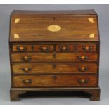 A George III figured mahogany bureau, with satinwood inlay to the sloping fall front & drawer