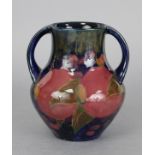 A William Moorcroft two-handled vase of ovoid shape decorated with the pomegranate design on a