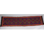 A Kashmiri hand-stitched wool chain runner, with repeating lozenge-shaped design within a narrow