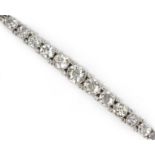 A FINE DIAMOND & PLATINUM FLEXIBLE BRACELET, early 20th century, set eleven graduated brilliant-